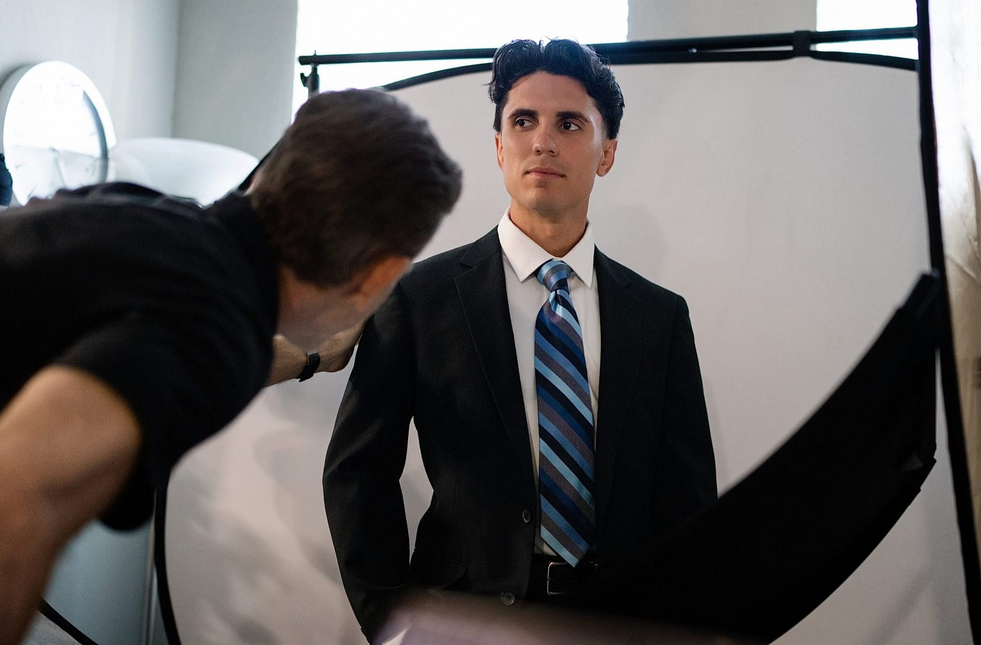 Expert posing guidance during a professional headshot session