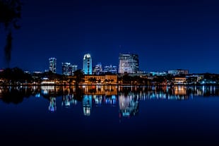 Blue Hour The downtown Orlando skyline reflected in the calm waters of Lake Ivanhoe during blue hour.